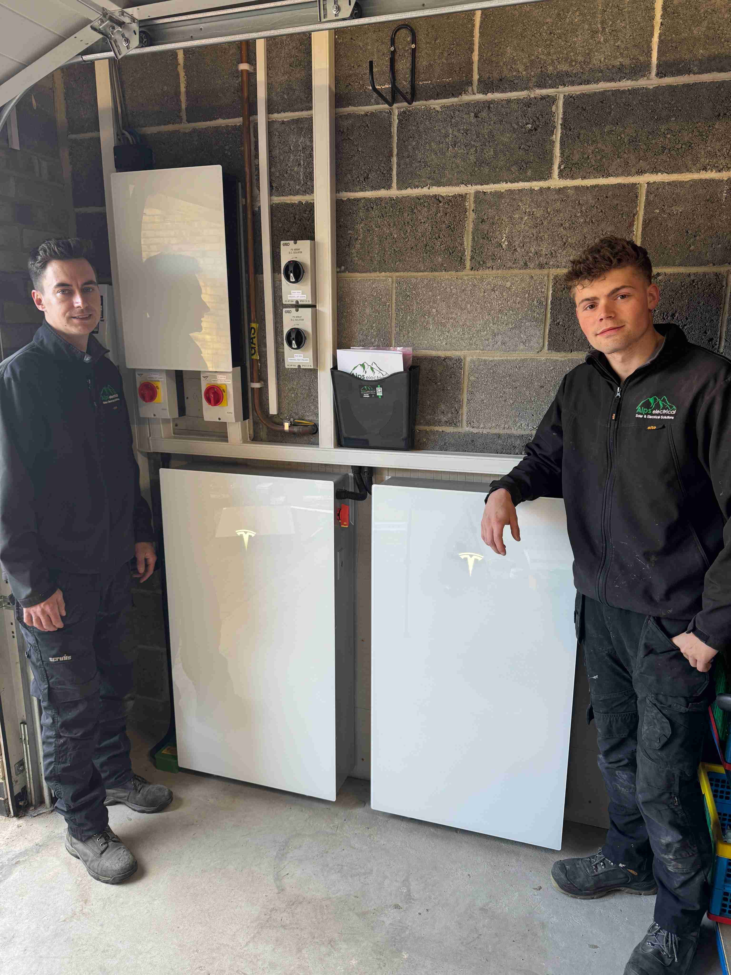 ALPS engineers with double Tesla Powerwall 3 installation in garage
