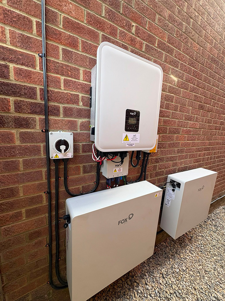 Fox ESS hybrid inverter and EP batteries installed on an outside wall in Durham by Alps Electrical